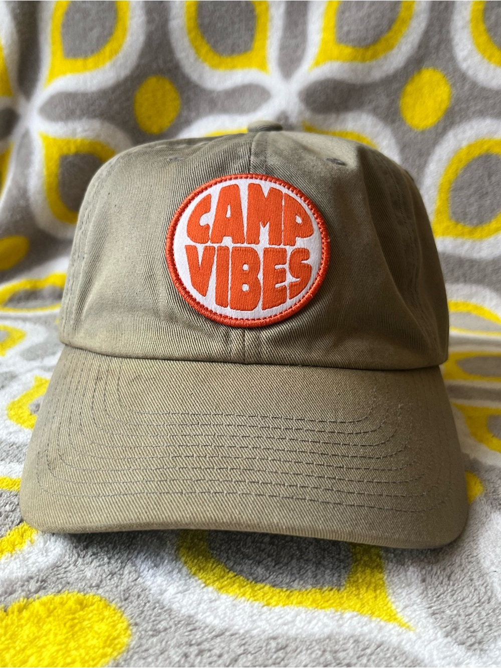 Poler Camp Vibes Patch Cap in Khaki with Orange and White Logo